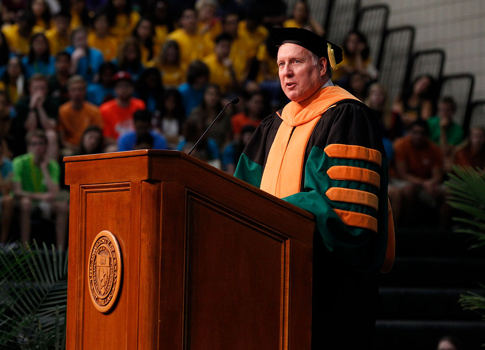 President Benson stands at the lectern during convocation. 